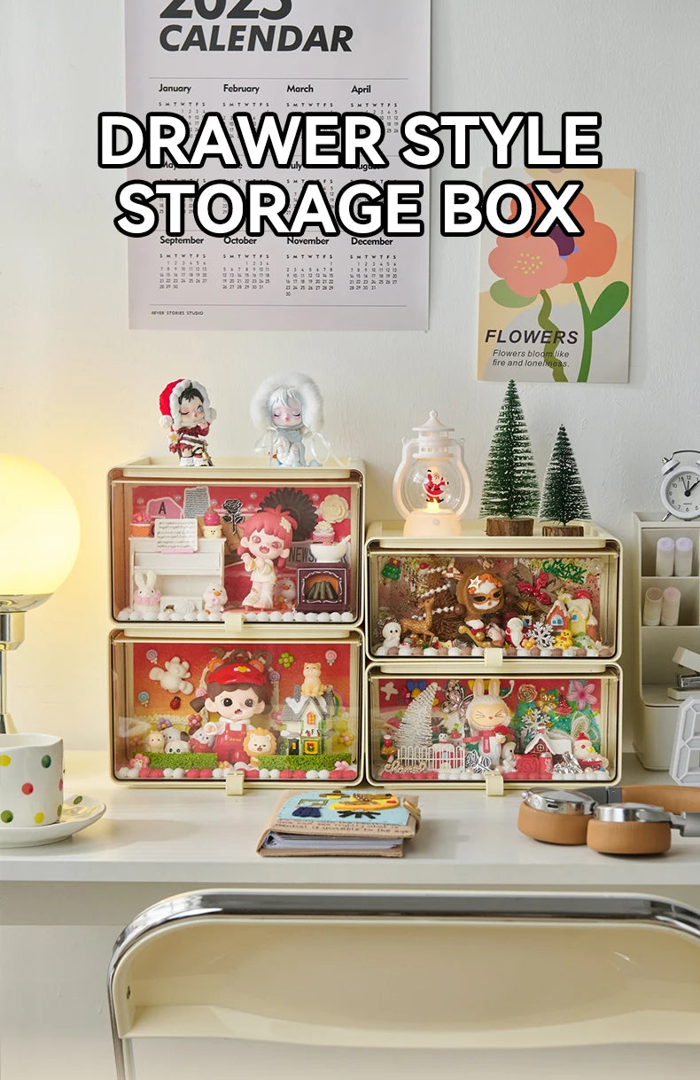 Drawer-style transparent display boxes stacked on a desk, showcasing decorative blind box figures and toys