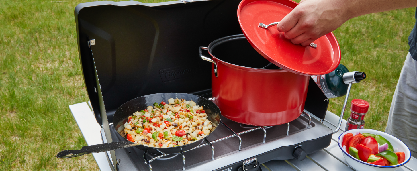 coleman stove grill breakfast pan pot red propane table seasoning bowl grass	yard tailgate bbq camp