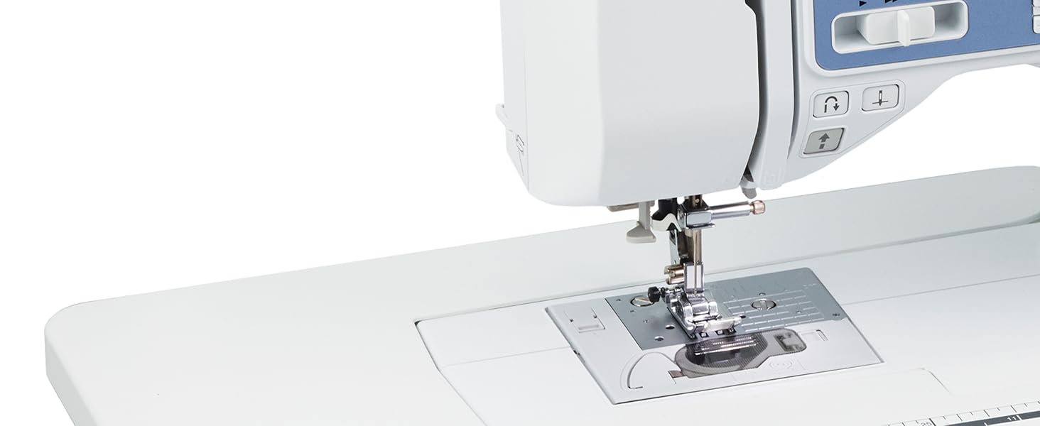 Close-up image showing machine's feed and needle threading system on white background