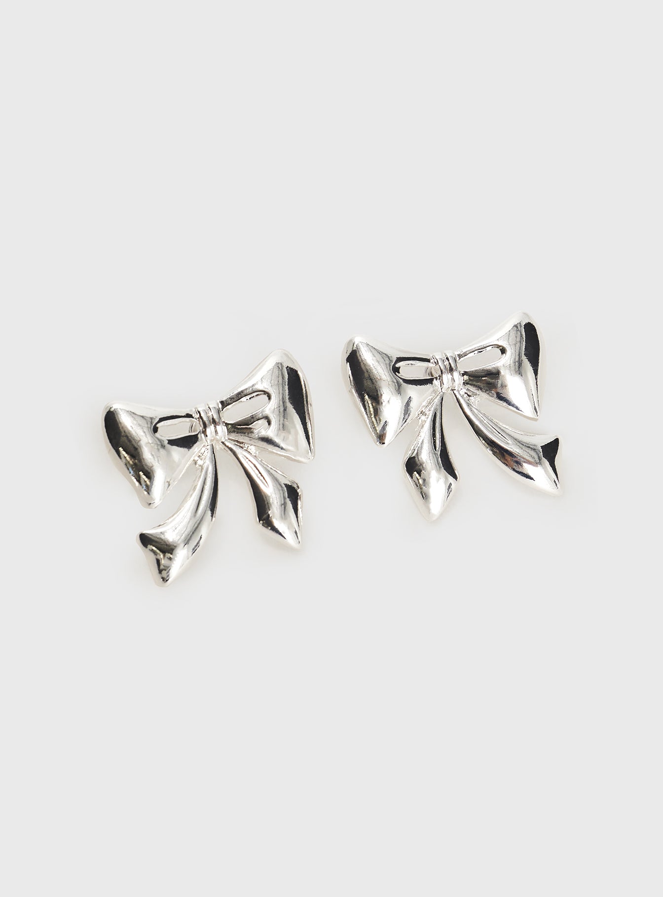 Make Believe Bow Earrings Silver、mySite、solidvoid