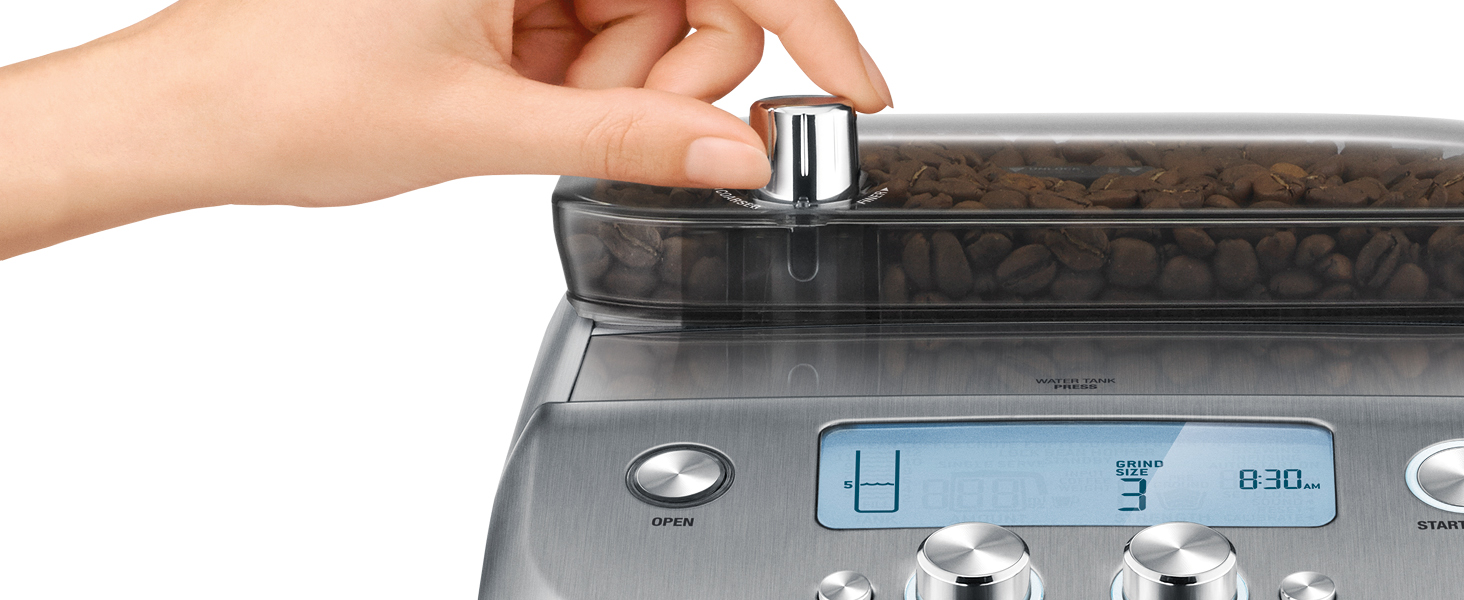 hand on coffee grinder