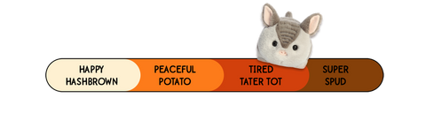 A Spudsters armadillo plush by Aurora that is placed at tired tater tot on the spud-o-meter